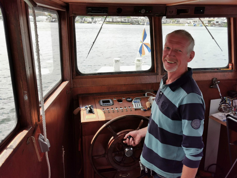 A friendly skipper proud of his boat